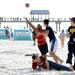 Members of the Michigan Marching Band play a game of football on the beach after perfuming for the fans at beach day in Clearwater, Fla. on Sunday, Dec. 30. Melanie Maxwell I AnnArbor.com